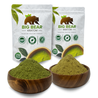 Two 250 gram Big Bear Kratom Pouches Side by Side behind two bowls of kratom powder.