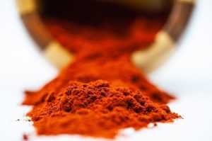 Bowl of premium red kratom powder showing deep reddish-brown color and fine texture